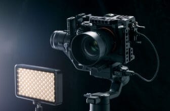 Professional digital camera on black background